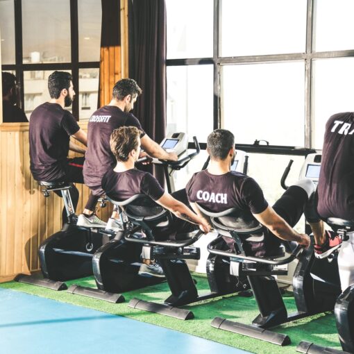 group of people sitting on black bench